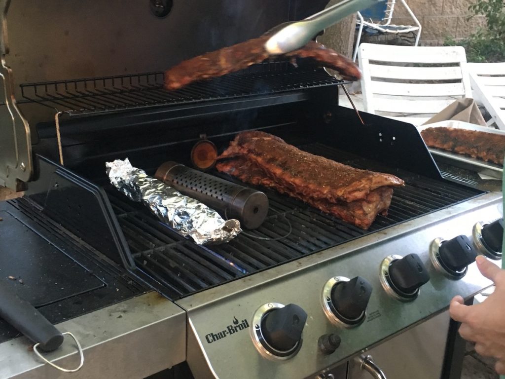 image of grill with ribs being cooked - best dry rub for ribs